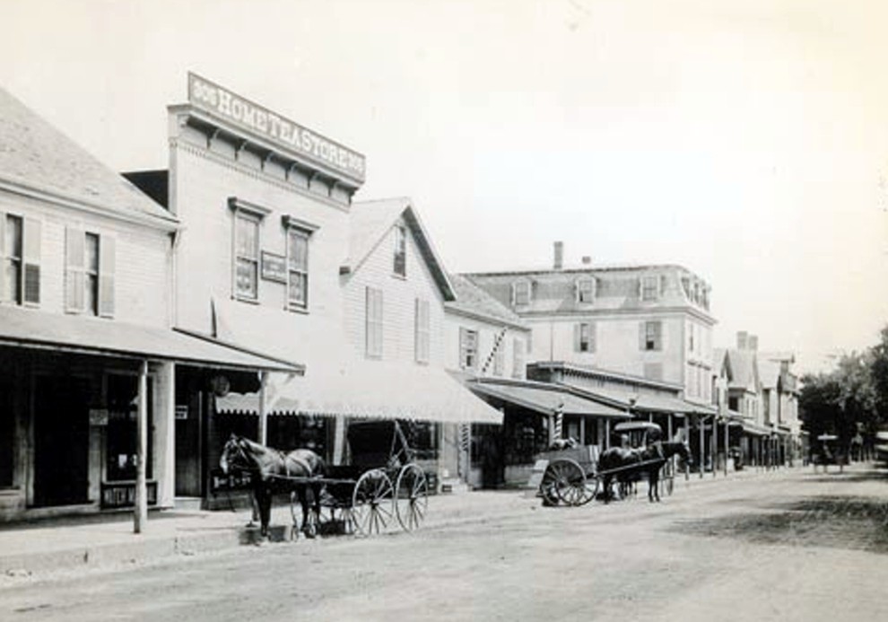 Image of stores on Main Street at Lexington Street circa 1880